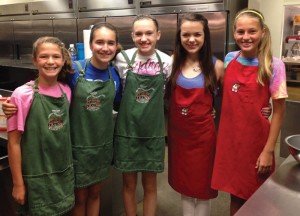 Isabella Chaiken, Bethany Kula, Sydney Gray, Carly Neal, and Logan Meade volunteering at Ronald McDonald House.