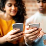 teenagers looking at their phone