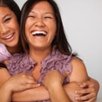 Mother and daughter laughing