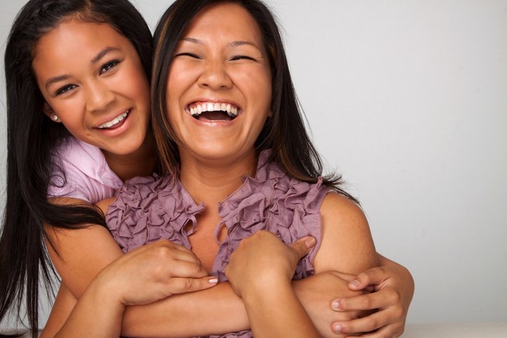 Mother and daughter laughing